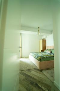 a bedroom with a bed in a room at CristAlex Sunset in Constanţa
