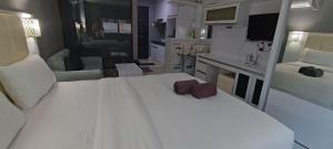 Ένα ή περισσότερα κρεβάτια σε δωμάτιο στο Nagoya Mansion Studio Level 9th