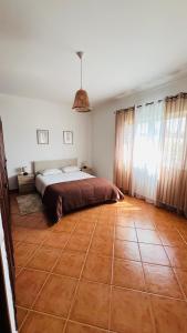 Ein Bett oder Betten in einem Zimmer der Unterkunft Quinta dos Moledros