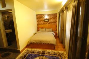 Katil atau katil-katil dalam bilik di Lumwoh Guest House