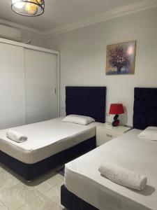 Ένα ή περισσότερα κρεβάτια σε δωμάτιο στο City Center Apartment 2 - Delta Sharm