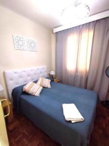Ένα ή περισσότερα κρεβάτια σε δωμάτιο στο Habitaciones en Luisa +17 φωτογραφίες