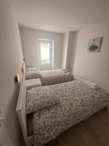 Ένα ή περισσότερα κρεβάτια σε δωμάτιο στο Appartement Duplex Bord de Mer
