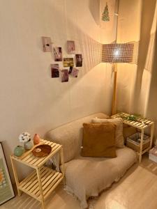 a living room with a couch and a table at KSPO,JYP,LotteTower, Sodamjae Stay in Seoul