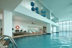 a pool in the lobby of a hotel at Tritower Near CIQ Johor Bahru by JCHOME MWM in Johor Bahru
