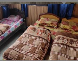 Postel nebo postele na pokoji v ubytování Hotel Swarnrekha Inn