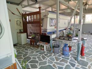 a living room with an rv parked in a room at DamAnda mare in Nea Potidaea