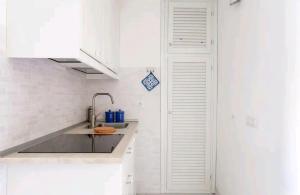 Kuchyň nebo kuchyňský kout v ubytování Maison Bilancia suite in Porto Rotondo