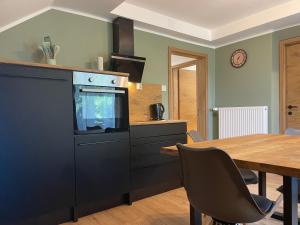 Kuchyň nebo kuchyňský kout v ubytování Maxi'Seeblick Apartments