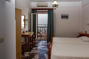 Postel nebo postele na pokoji v ubytování Lefteris Rooms