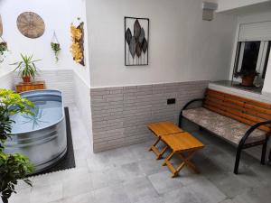 Posezení v ubytování Apartamentos De la Haya & Suite con Jacuzzi, junto al Teatro Romano