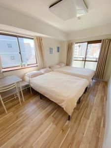 Postel nebo postele na pokoji v ubytování 《難波・心斎橋にアクセス最高！》宿泊2名