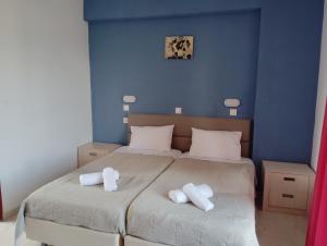 Ένα ή περισσότερα κρεβάτια σε δωμάτιο στο Kavos Fantasia Complex