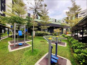 a park with a playground with a slide at Ipoh Manhattan Waterpark Suite by City Home Empire MHB403 in Ipoh