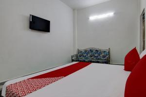 Postel nebo postele na pokoji v ubytování Hotel O R S Guest House