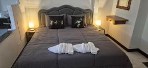 a bedroom with a bed with two towels on it at Palmgarden Resort Samui - only Adult - neu Saniert in Ban Tai +45 photos