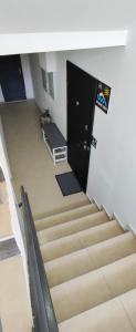a stairway with a door and stairs with a stair case at Студио Нико - Царево in Tsarevo