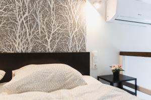 Ένα ή περισσότερα κρεβάτια σε δωμάτιο στο Cozy Dowtown Lofts