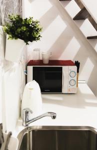 Η κουζίνα ή μικρή κουζίνα στο Cozy Dowtown Lofts +32 φωτογραφίες