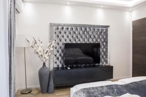 En eller flere senge i et værelse på Rebany Apartman 4 Central Location