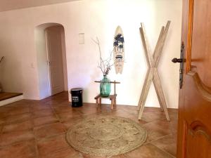 a hallway with a table and a vase on a floor at Villa Pio in Roquebrune-sur-Argens +17 photos
