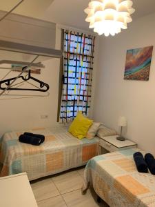Postel nebo postele na pokoji v ubytování Apartamento el Carmen