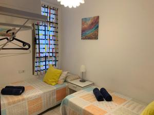 Postel nebo postele na pokoji v ubytování Apartamento el Carmen