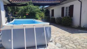 a hot tub sitting outside of a house at Villa Glicine Casa Vacanze con Piscina e Camino ad Apecchio, Marche in Apecchio