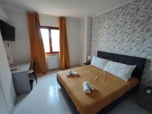Postel nebo postele na pokoji v ubytování Guest house Sinisi