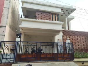 a house with an iron gate and a balcony at One4ALL SALVIA in Chennai