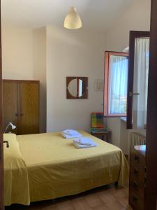 Cama ou camas em um quarto em Appartamento Rosa