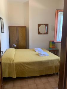 Cama ou camas em um quarto em Appartamento Rosa