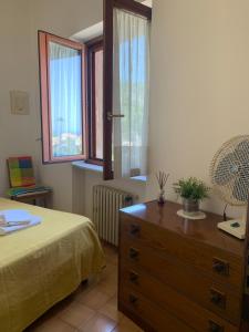 Cama ou camas em um quarto em Appartamento Rosa