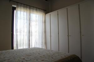 Ένα ή περισσότερα κρεβάτια σε δωμάτιο στο Soleado Apartment - Un sogno tra le meraviglie di Marinagri