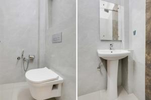 une salle de bain blanche avec toilettes et lavabo dans l'établissement Townhouse Oak Haldwani Kathgharia Chowk, à Haldwani
