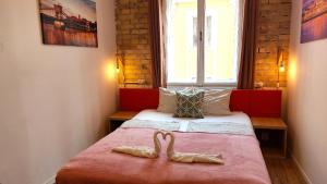 Postel nebo postele na pokoji v ubytování GoodMo Budapest Smart Rooms