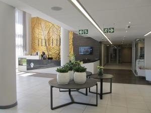 Et tv og/eller underholdning på Menlyn Maine Luxury Apartment