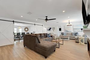 a living room with a couch and a table at Sunset Splash in Siesta Key