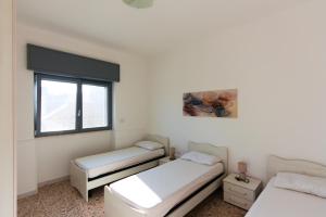 Postel nebo postele na pokoji v ubytování Samarà Sx