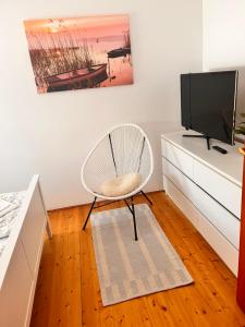 Televízia a/alebo spoločenská miestnosť v ubytovaní Rege apartman 2