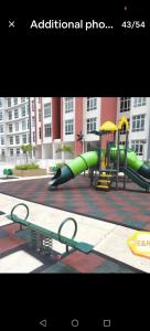 a playground with a green slide at Anderson Condo ipoh in Ipoh