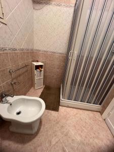 a bathroom with a toilet and a sink and a shower at Al Tribunale Guest House in Palermo +19 photos