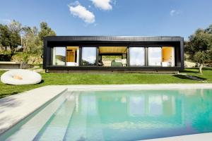 a house with a swimming pool in the yard at Vilela Valley in Cabeceiras de Basto