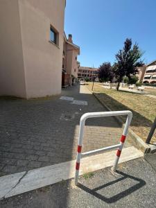 a barrier on a sidewalk next to a building at Roma Mare Apartment in Palidoro