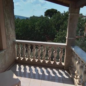 a balcony of a house with a view at Rooms direct at Metro pallini 200 meter from Train Station and 3 station to Airport and central station to go anywhere to all Athens from here in Pallíni