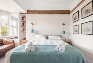 a bedroom with a bed with towels on it at East Lodge - Chillingham Castle in Alnwick