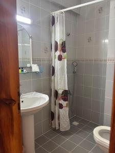 a bathroom with a sink and a shower curtain at Villa Truva in Fethiye +67 photos