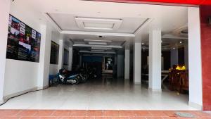 a hallway with a motorcycle parked in a building at Peaceful Mountain Hotel in Ha Giang