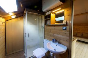 a bathroom with a toilet and a sink and a shower at Resort Orizzonti Glamping in SantʼElpidio a Mare +41 photos
