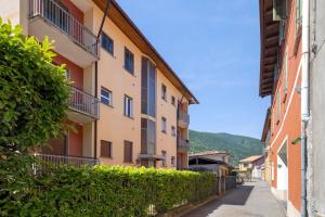 an empty street in a city with buildings at Maison Petrolini - Maggiore Estate by Ginin in Cannobio